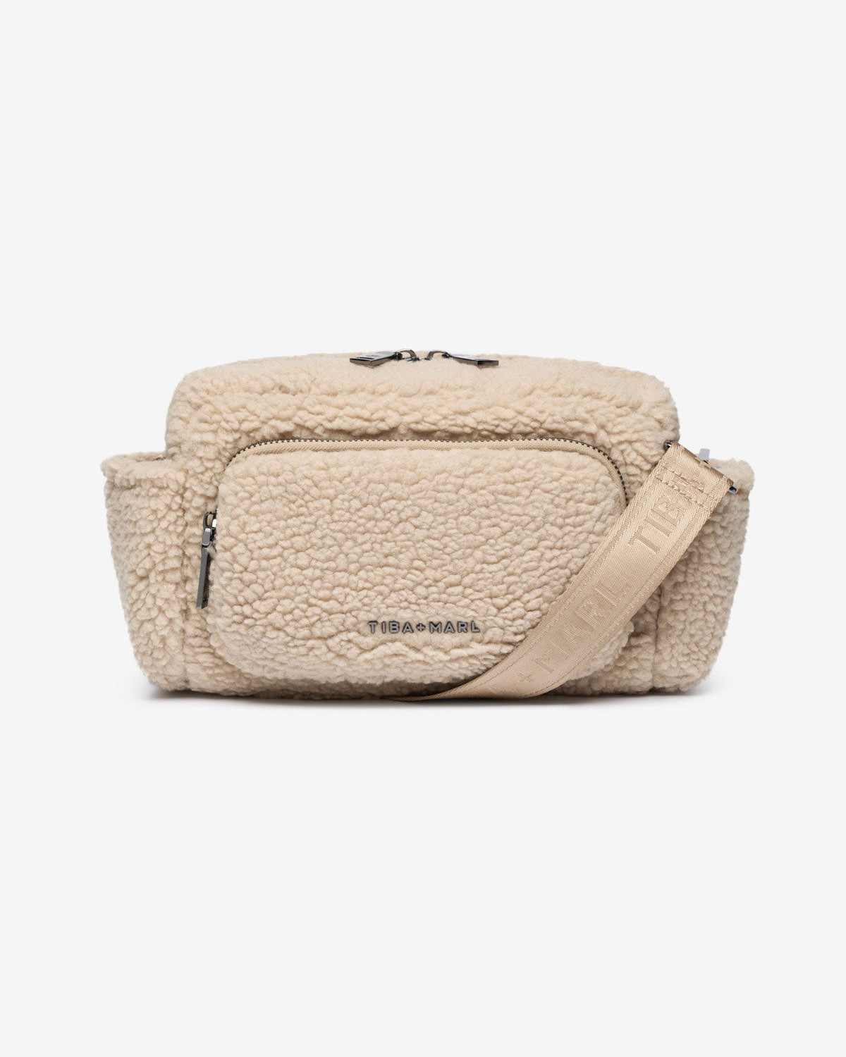 A beige borg fleece buggy organiser with multiple compartments and a shoulder strap, with the brand name visible.