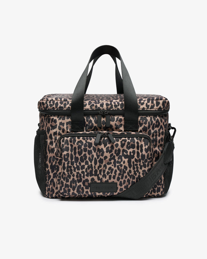 Leopard print insulated cool bag with a webbing cross body strap and a large zip up front pocket.