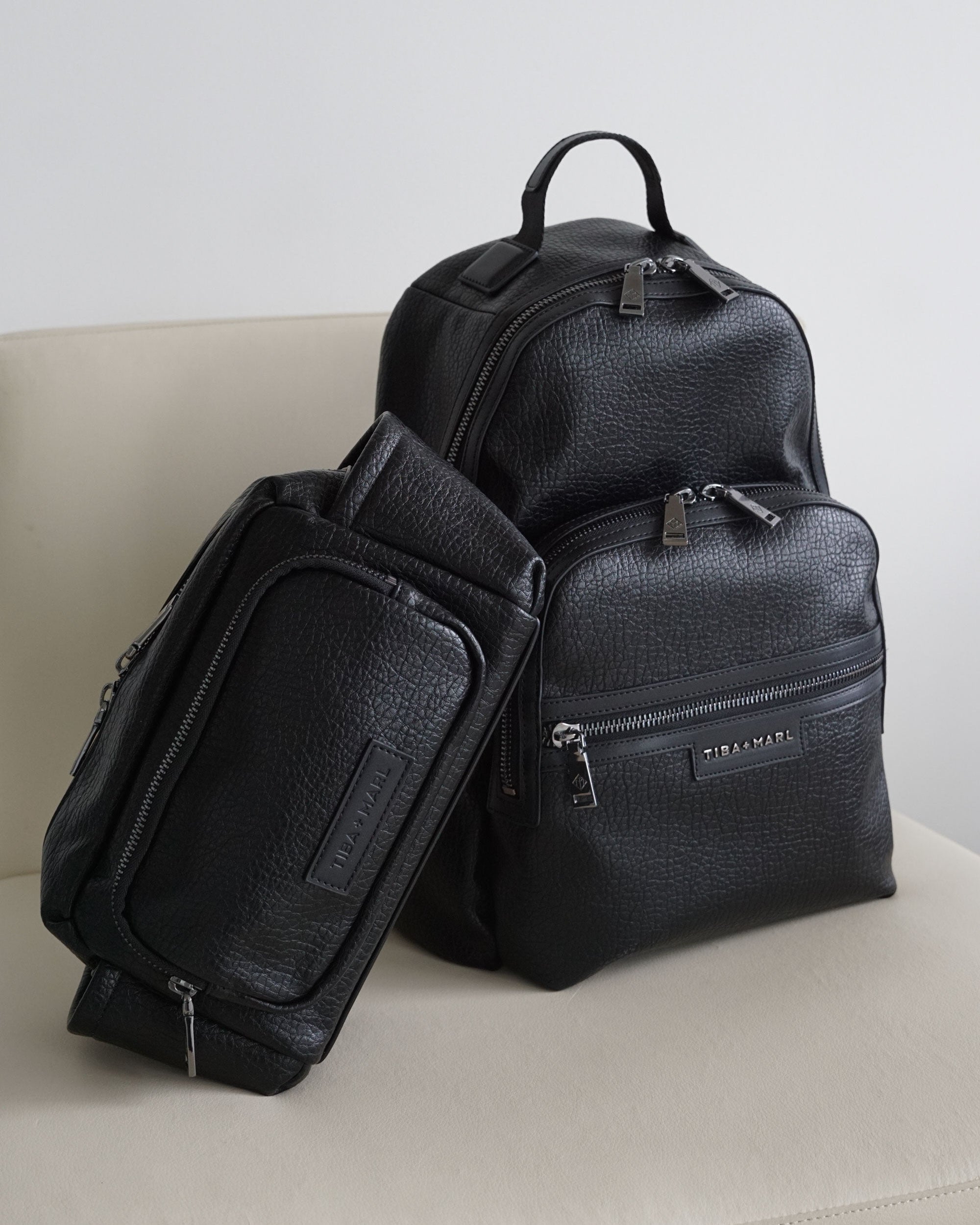 Black Elwood backpack and Inka buggy organiser styled together